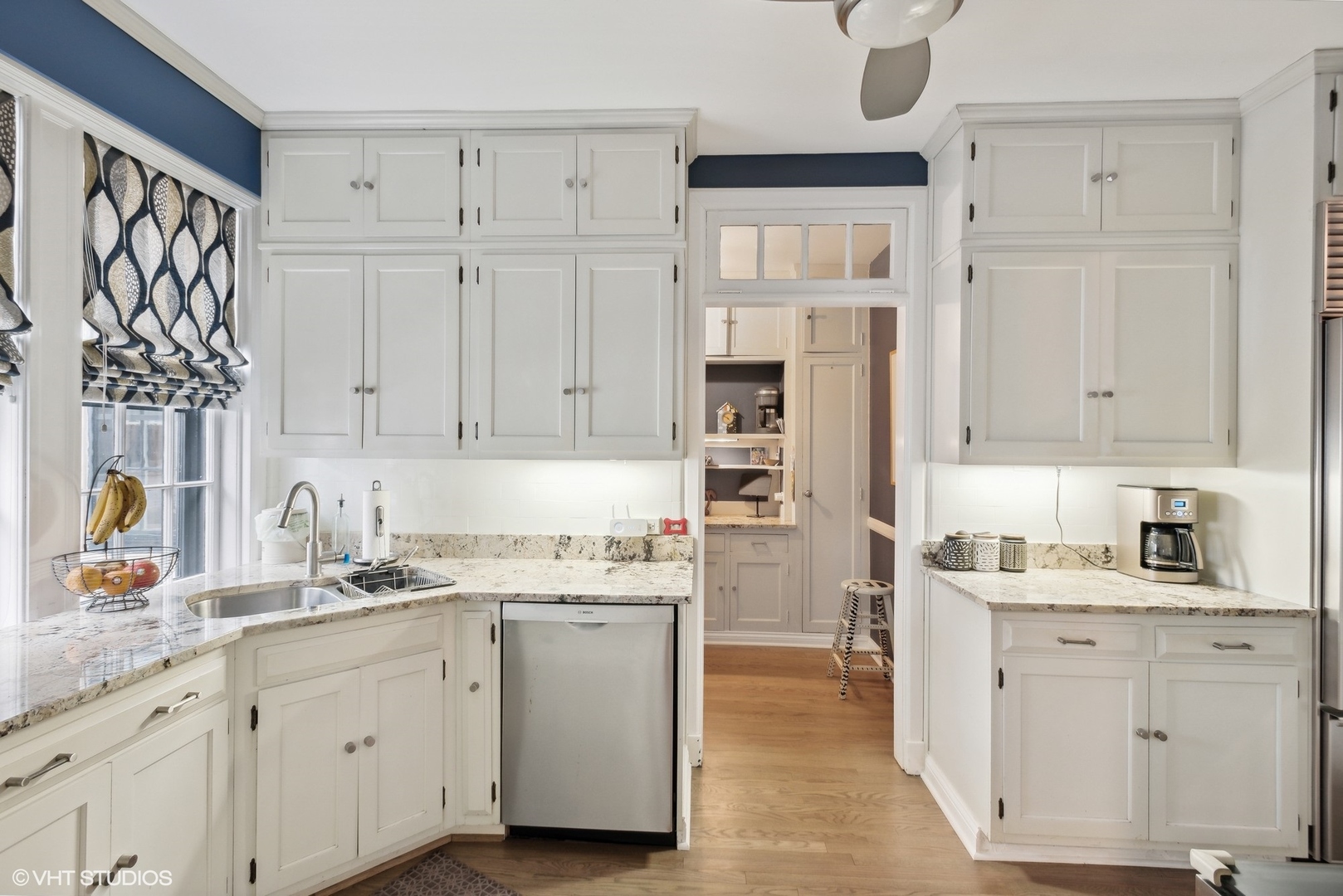 200 Lee Street, Unit 1B Evanston, IL 60202 - Photo 10 of 26 a kitchen with white cabinets and sink