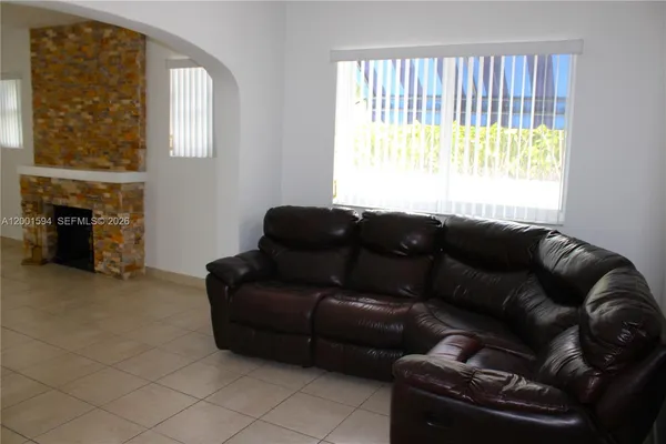 a view of a utility room with wooden floor