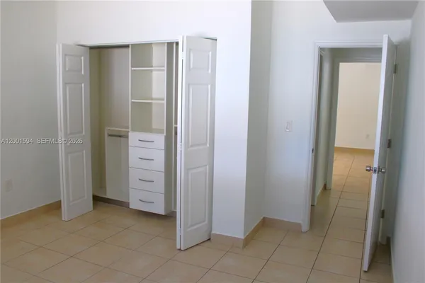 a kitchen with stainless steel appliances granite countertop a stove and a refrigerator