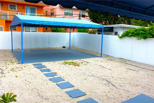 a view of a backyard of a house