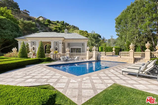 a view of a bathroom with a glass door shower and a sink