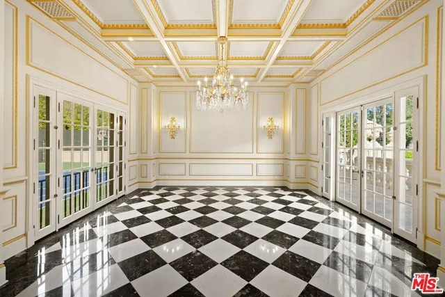 a view of a house with a lot of flower plants