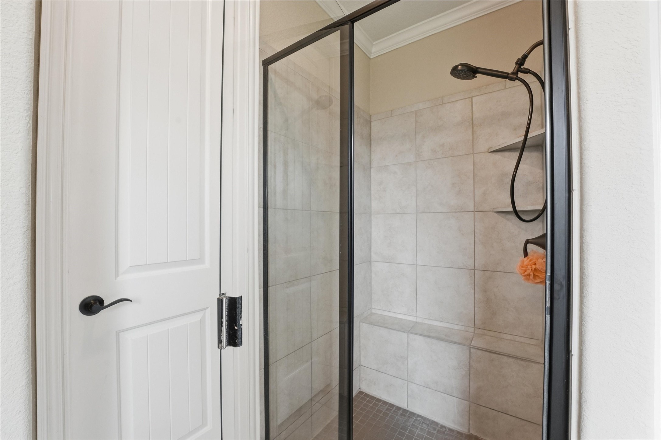 12506 Northpointe Ridge Lane Tomball, TX 77377 - Photo 18 of 31 a bathroom with a glass shower door