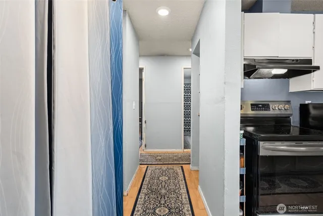 a view of a kitchen from the hallway