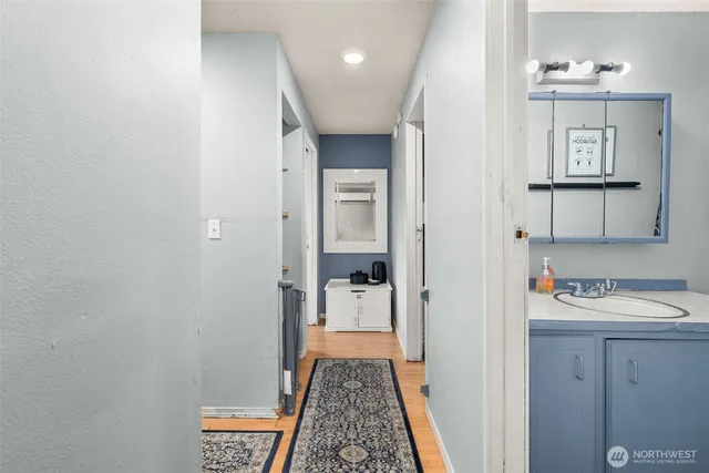 a bathroom with a sink and a mirror