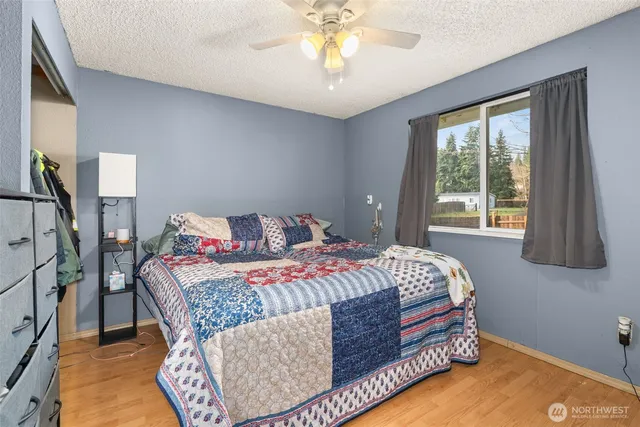 a bedroom with a bed and a window