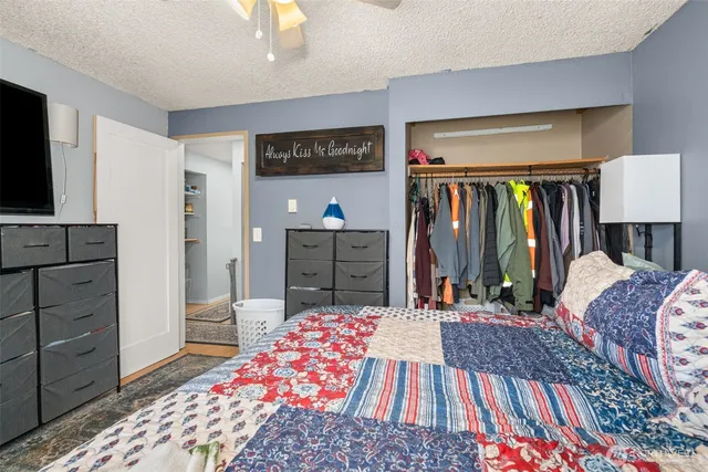 a bedroom with a bed and furniture