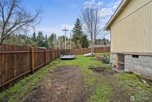 a backyard of a house with lots of green space