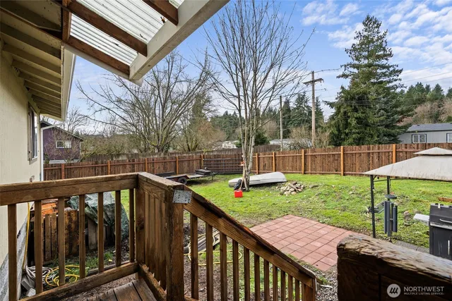 a view of a deck with a backyard