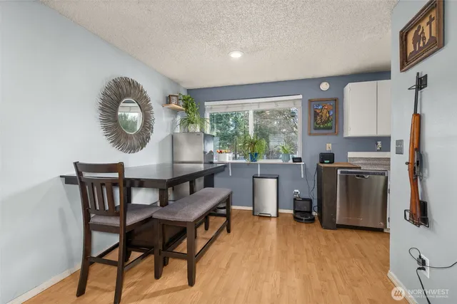 a view of a dining room with furniture window and wooden floor