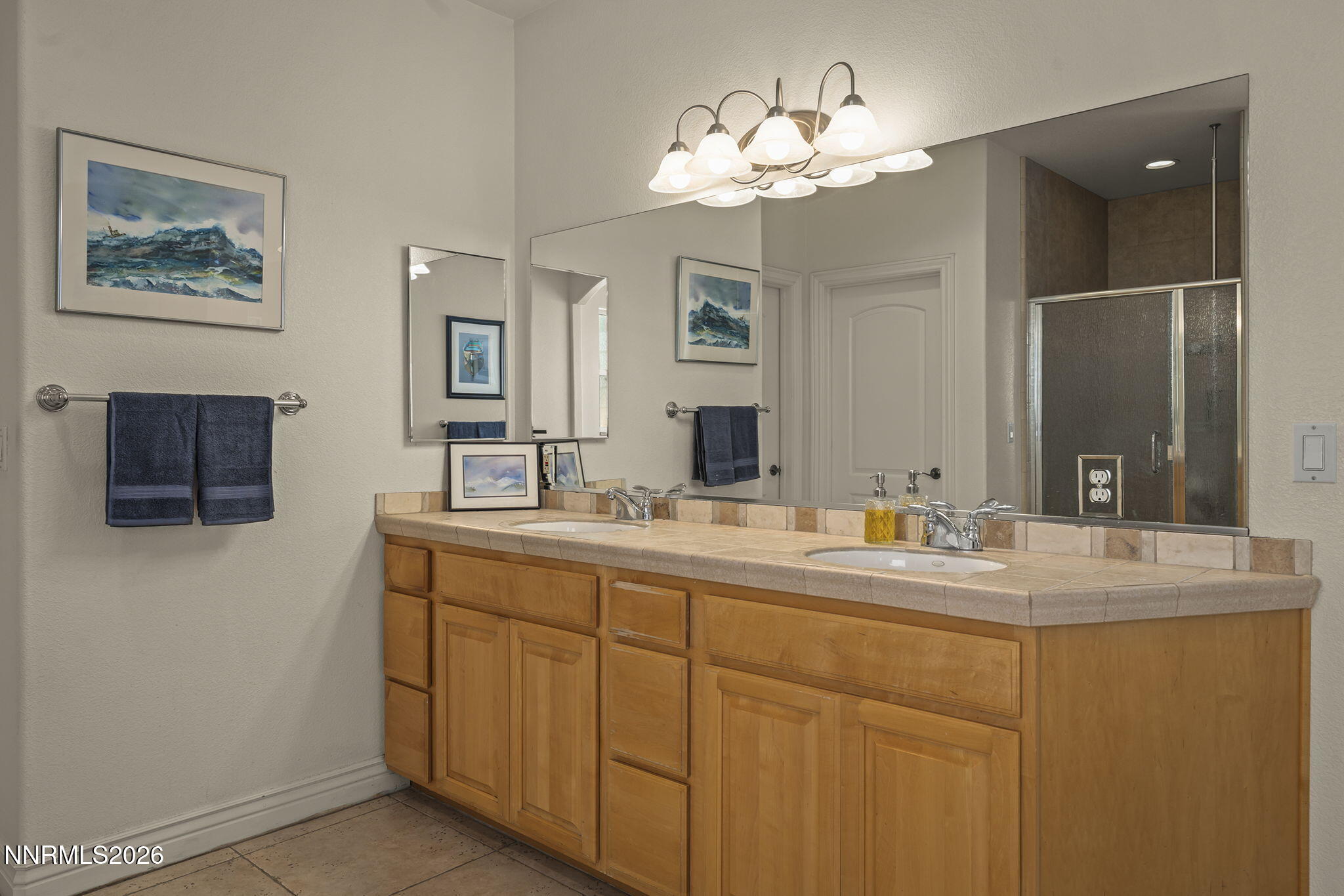 12635 Silver Wolf Road Reno, NV 89511 - Photo 31 of 48 a bathroom with a double vanity sink and a mirror
