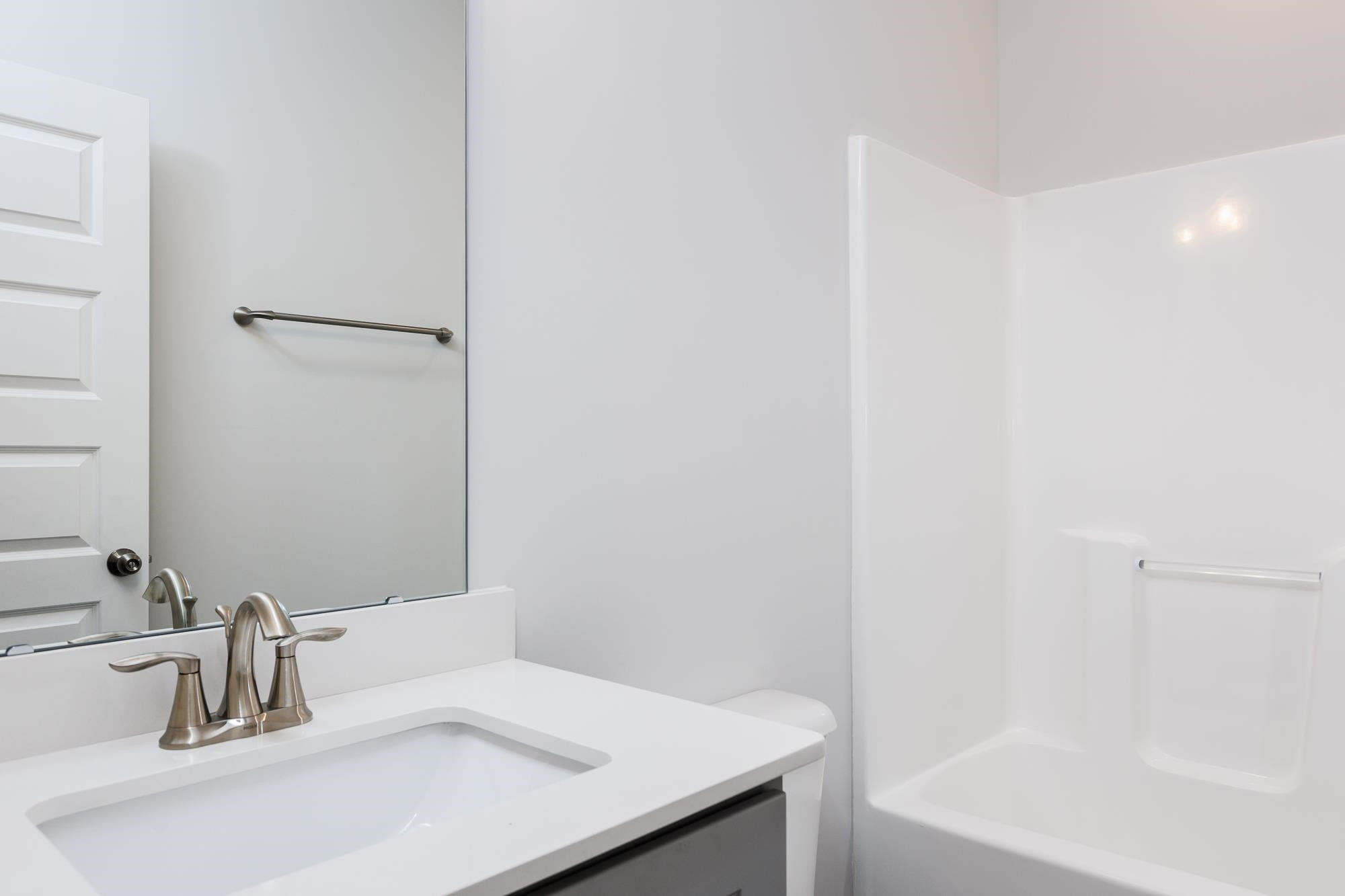 8222 Ebenezer Church Road Raleigh, NC 27613 - Photo 13 of 18 a bathroom with a sink and a bathtub