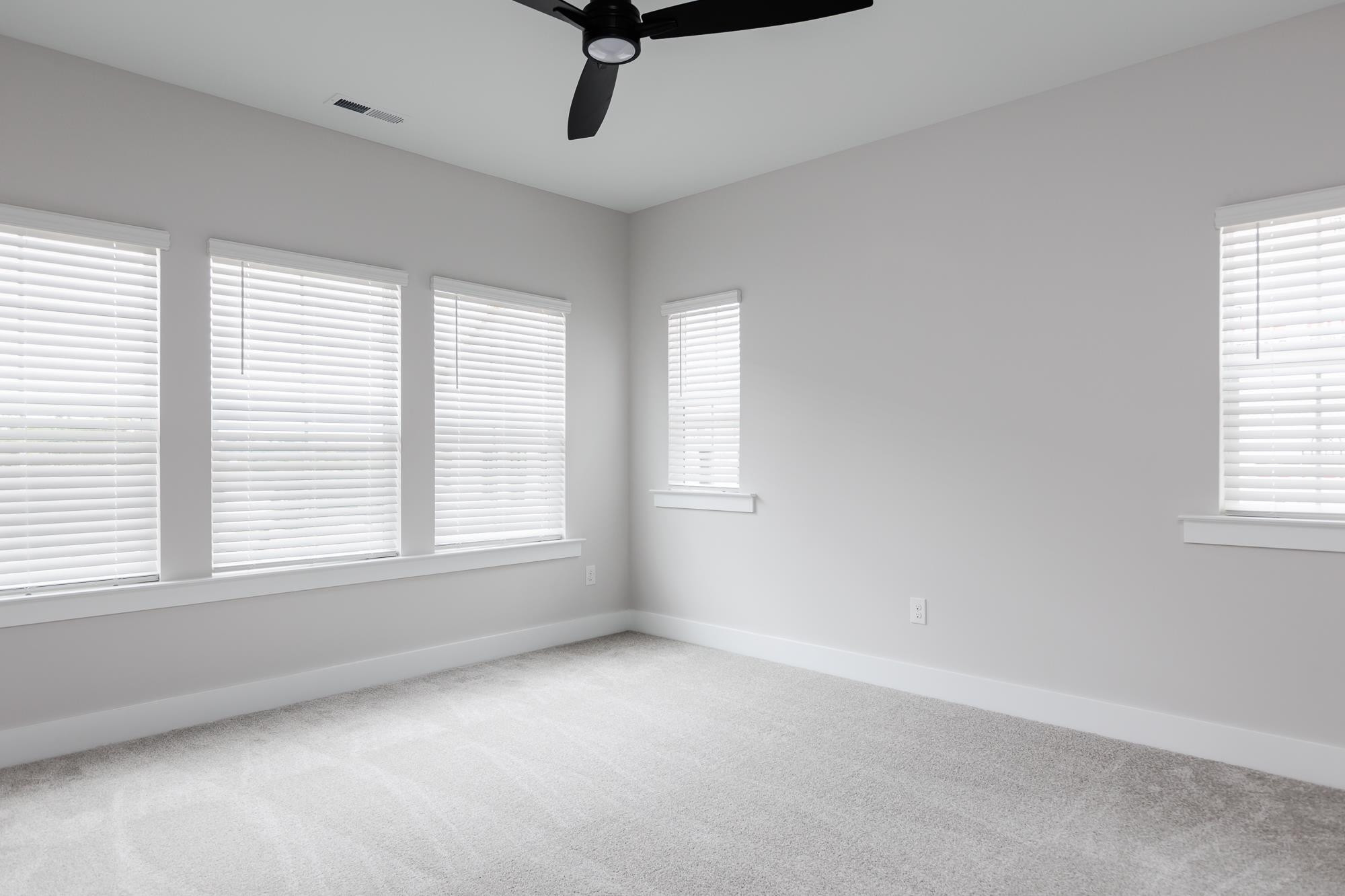 8222 Ebenezer Church Road Raleigh, NC 27613 - Photo 7 of 18 a view of an empty room with a window