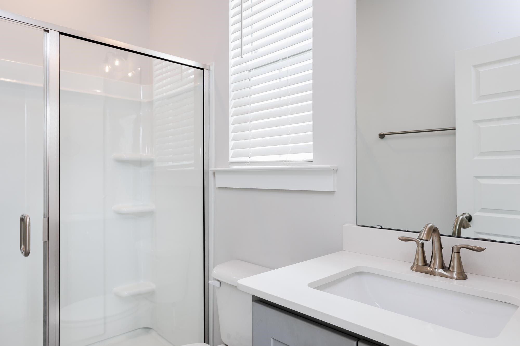 8222 Ebenezer Church Road Raleigh, NC 27613 - Photo 8 of 18 a bathroom with a sink and a mirror
