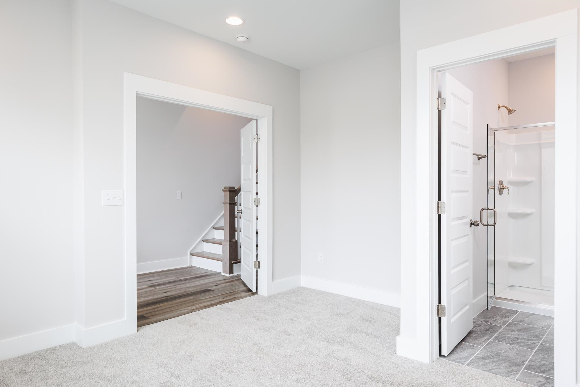 8222 Ebenezer Church Road Raleigh, NC 27613 - Photo 9 of 18 a view of a hallway with wooden floor and entryway
