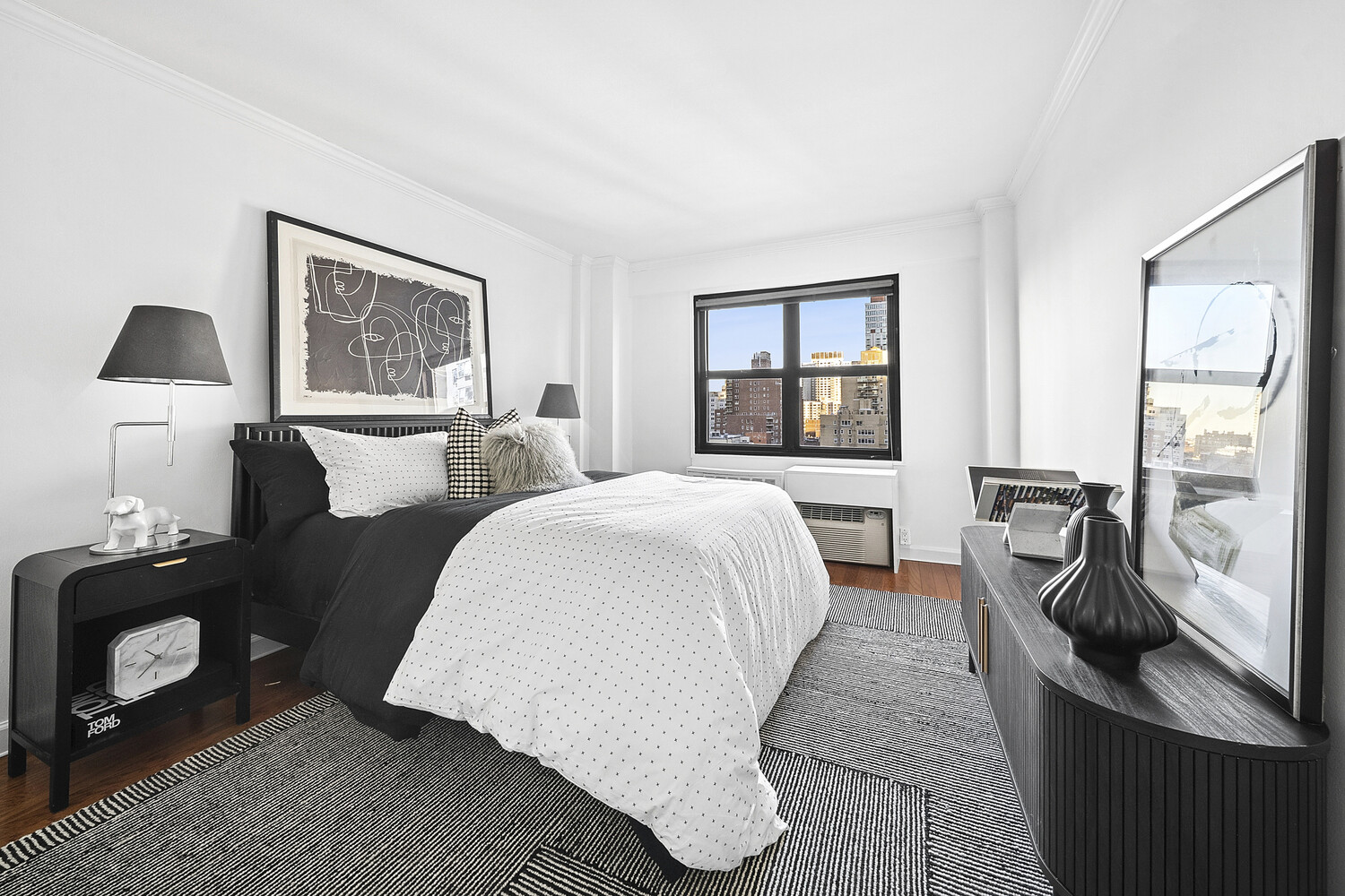 240 East 76th Street, Unit 14G Manhattan, NY 10021 - Photo 3 of 7 a living room with furniture and a window