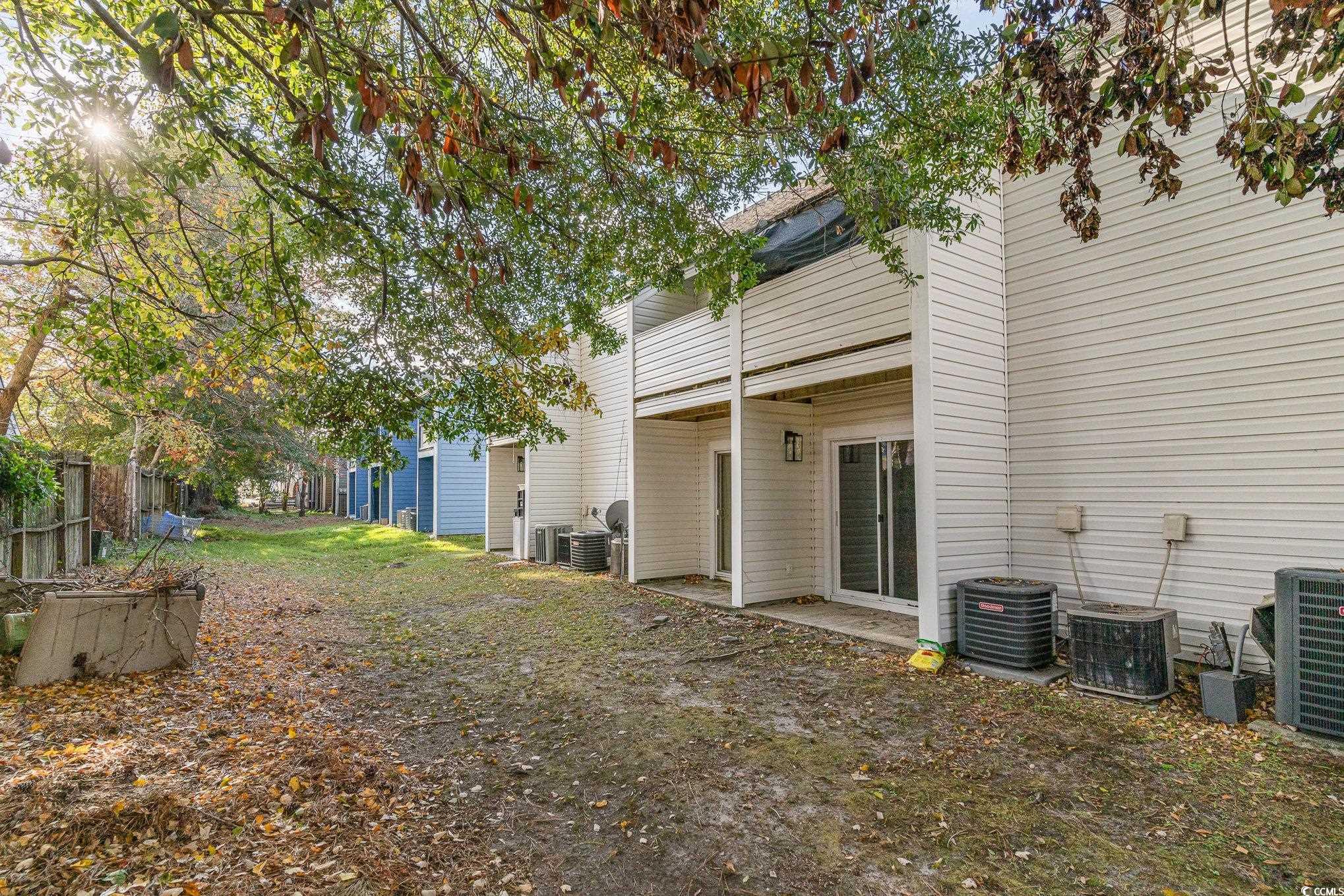 416 Cambridge Circle, Unit H3 Murrells Inlet, SC 29576 - Photo 15 of 15 View of yard featuring central AC unit