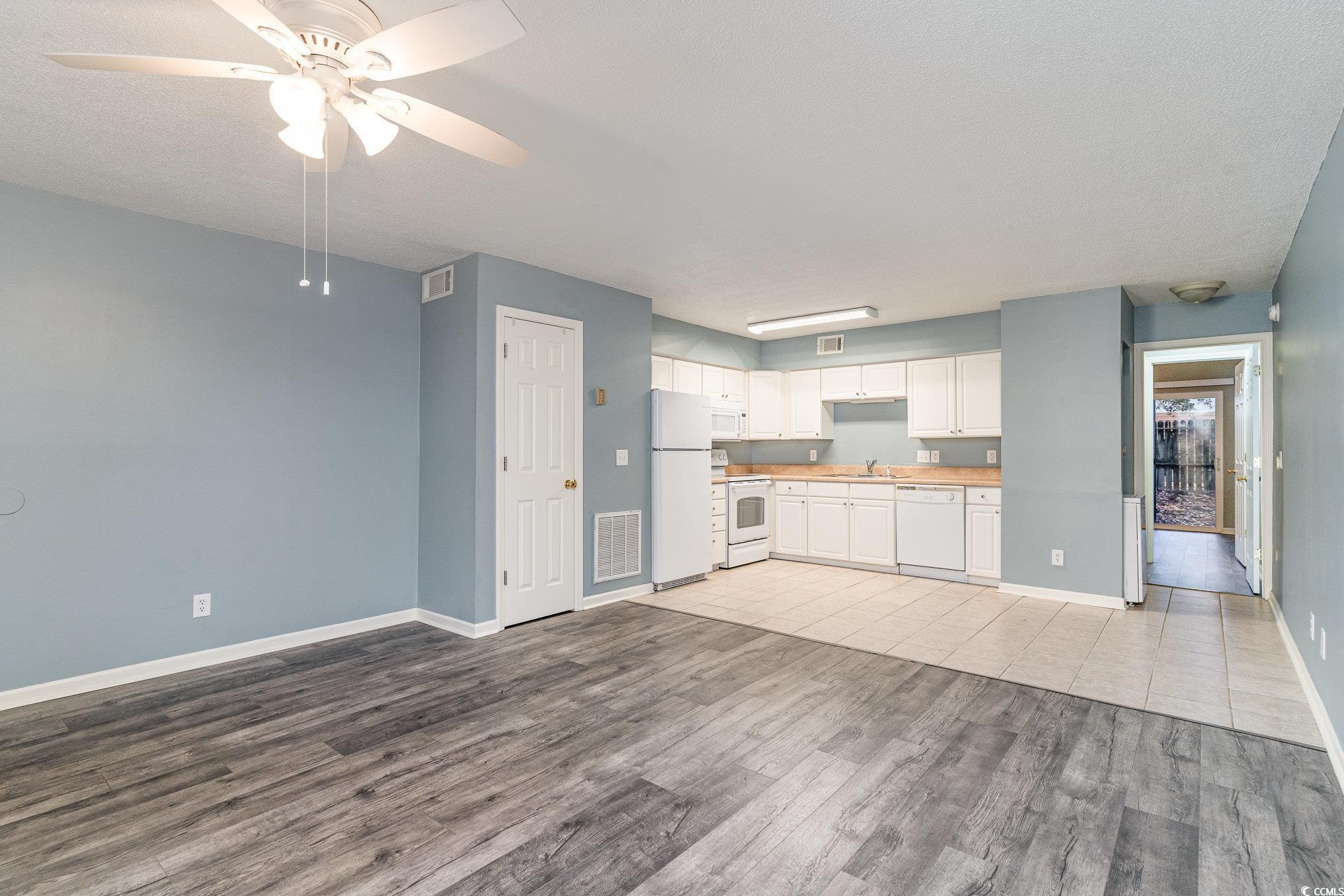 416 Cambridge Circle, Unit H3 Murrells Inlet, SC 29576 - Photo 3 of 15 Kitchen with ceiling fan, sink, light hardwood / w