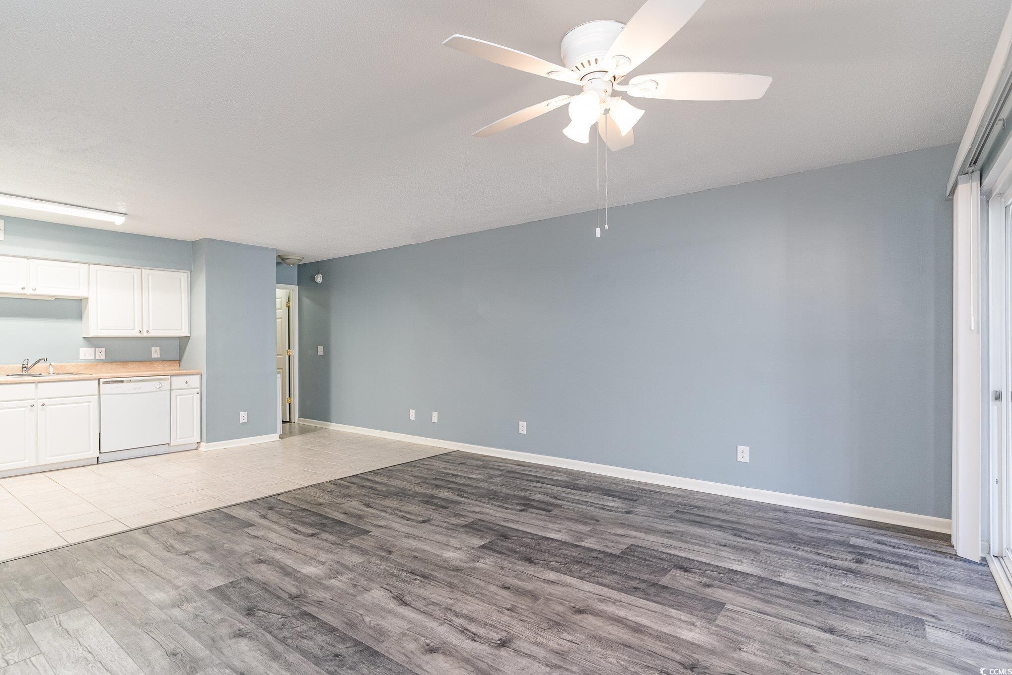 416 Cambridge Circle, Unit H3 Murrells Inlet, SC 29576 - Photo 4 of 15 Unfurnished living room featuring ceiling fan, lig
