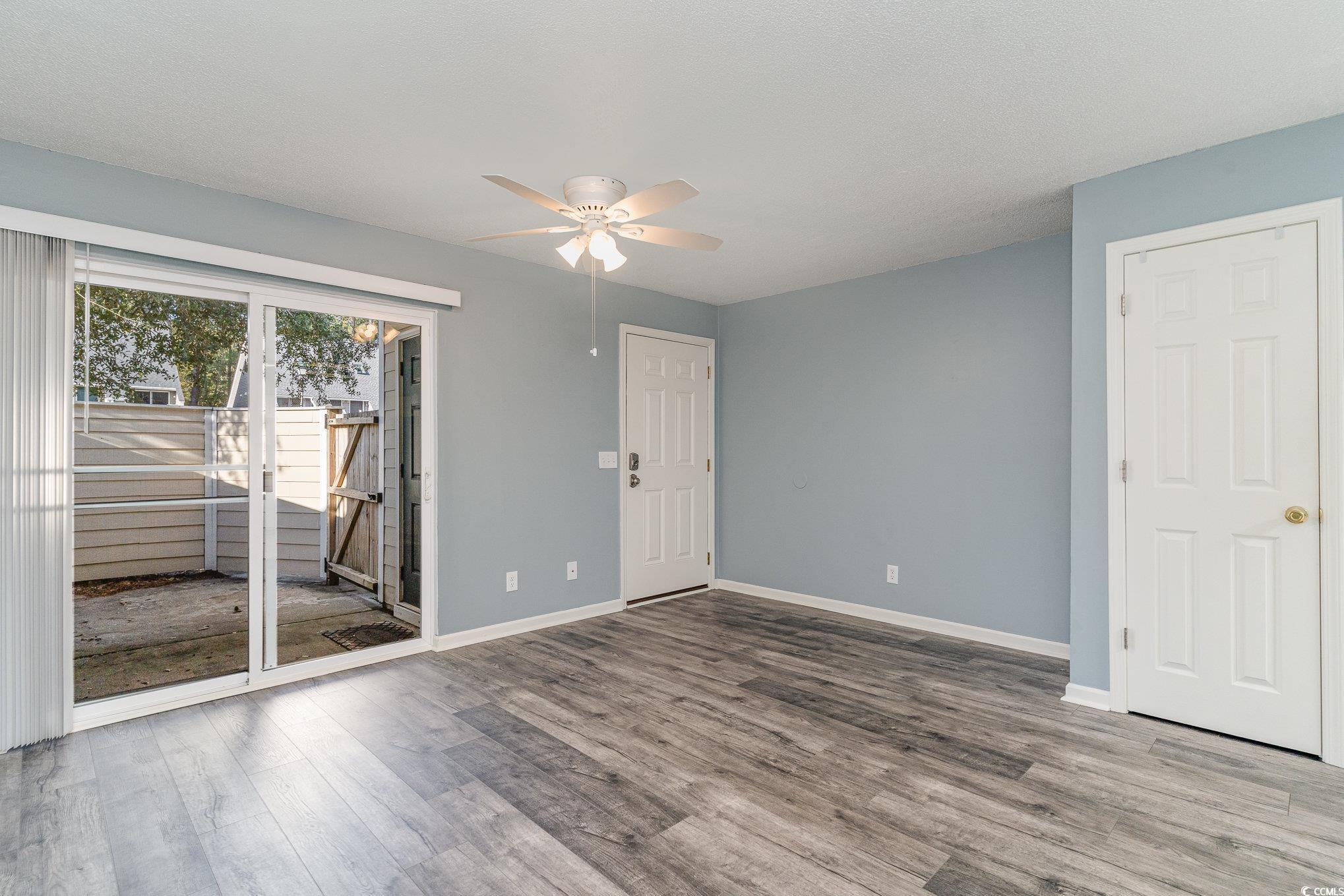 416 Cambridge Circle, Unit H3 Murrells Inlet, SC 29576 - Photo 5 of 15 Unfurnished room with hardwood / wood-style floori