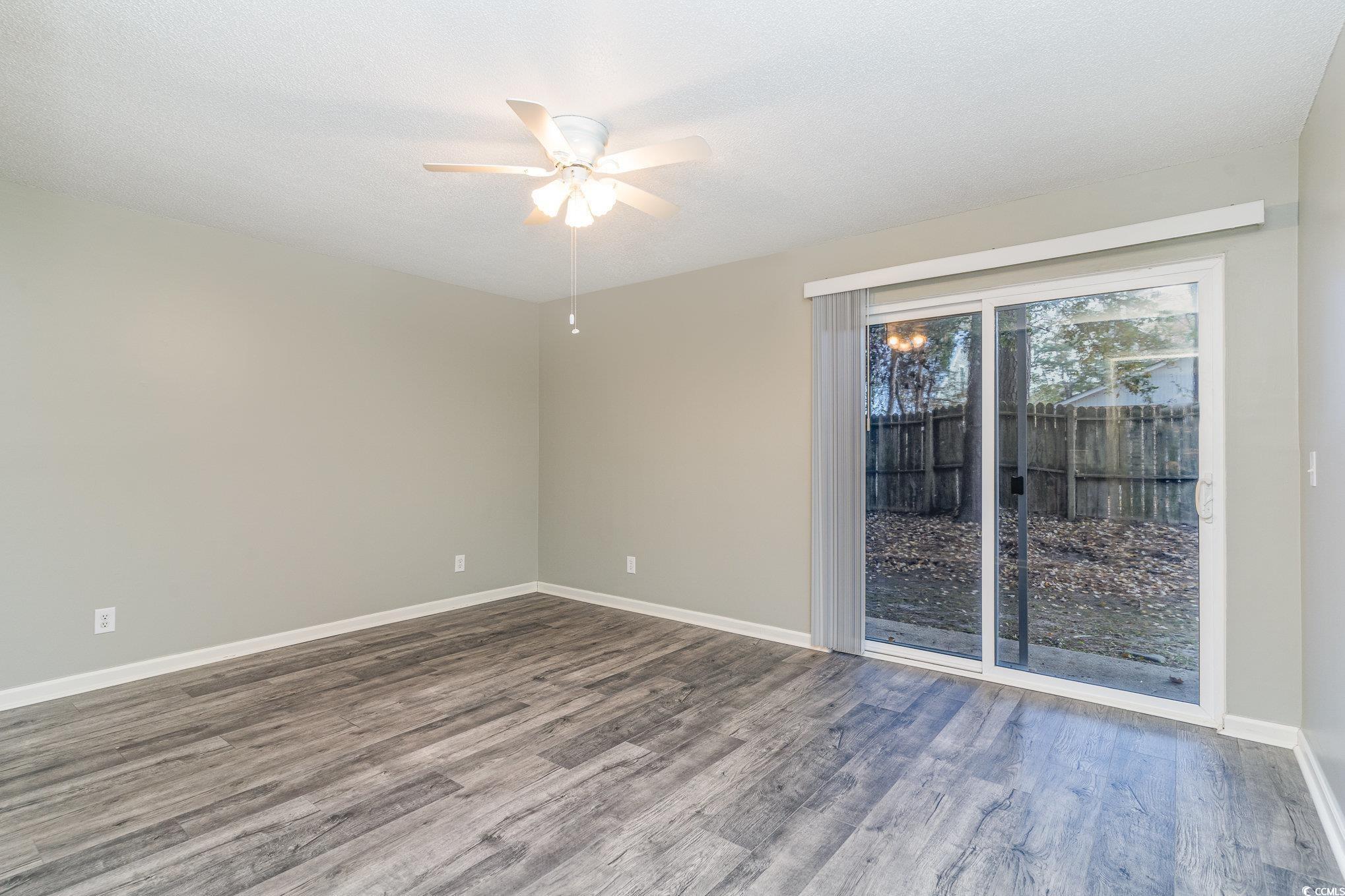 416 Cambridge Circle, Unit H3 Murrells Inlet, SC 29576 - Photo 8 of 15 Spare room with ceiling fan, a textured ceiling, a