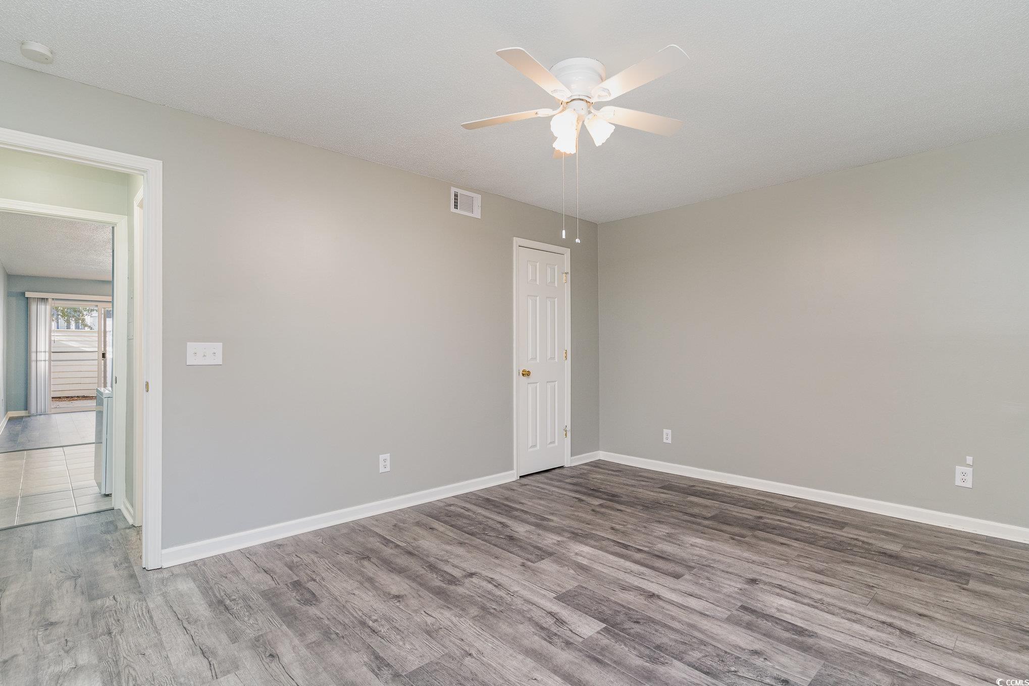 416 Cambridge Circle, Unit H3 Murrells Inlet, SC 29576 - Photo 9 of 15 Unfurnished room featuring hardwood / wood-style f
