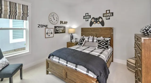 a bedroom with bed and a window