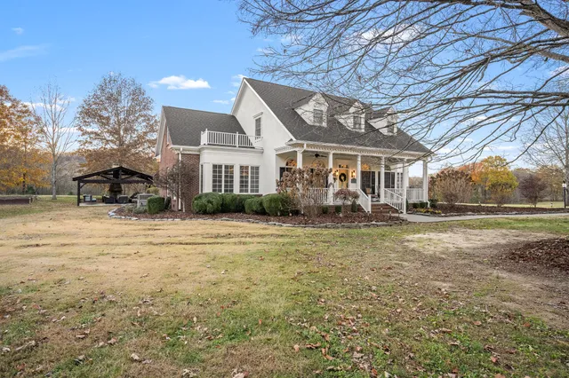 a spacious bathroom with a sink a vanity and a mirror