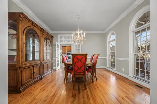 a bedroom with a large bed and a large window
