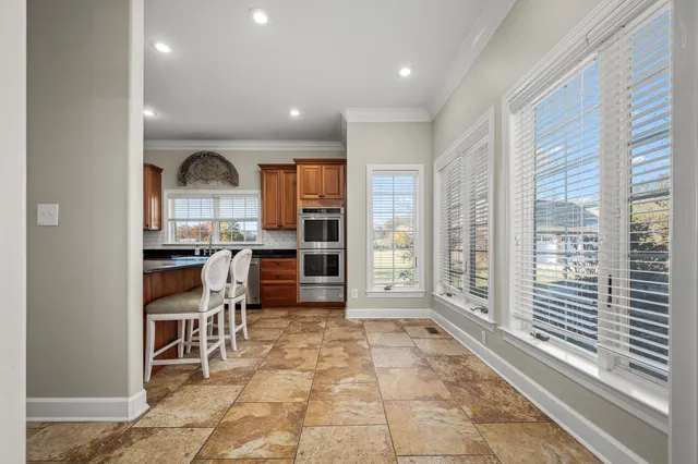a view of a dining room with furniture window and outside view