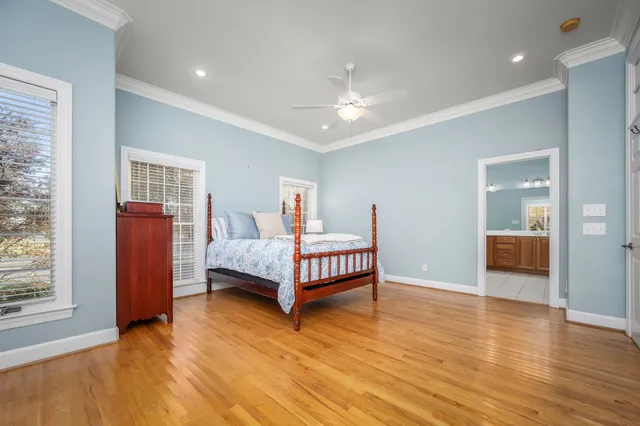 a view of a backyard with table and chairs with wooden floor and fence