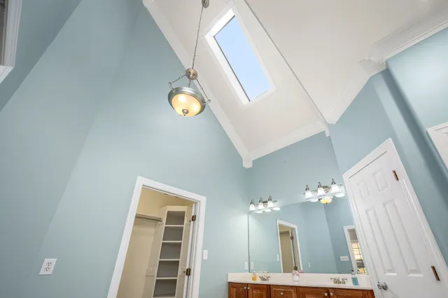 a view of a patio with table and chairs potted plants