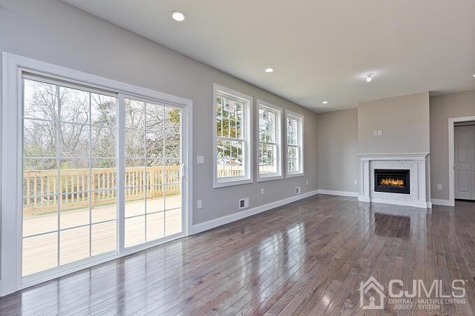 1214 Brookside Road Piscataway, NJ 08854 - Photo 11 of 26 a view of an empty room with a window and wooden floor