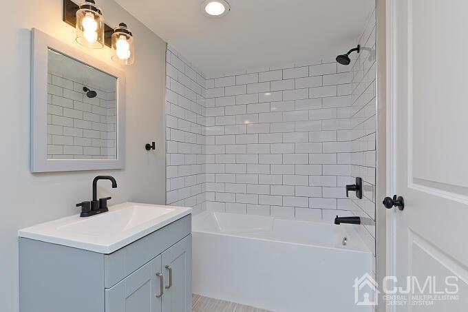 1214 Brookside Road Piscataway, NJ 08854 - Photo 14 of 26 a bathroom with a sink a toilet and shower