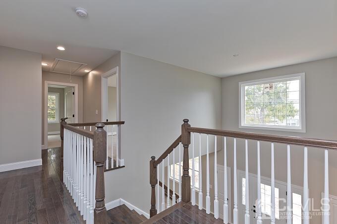 1214 Brookside Road Piscataway, NJ 08854 - Photo 15 of 26 a view of hallway with stairs and wooden floor