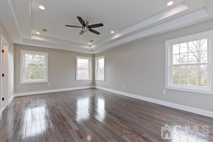 1214 Brookside Road Piscataway, NJ 08854 - Photo 16 of 26 a view of an empty room with wooden floor and a window