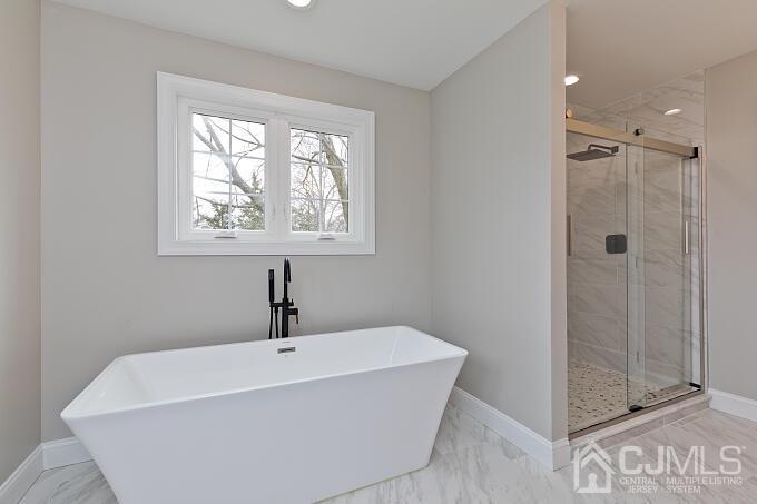 1214 Brookside Road Piscataway, NJ 08854 - Photo 18 of 26 a white bath tub sitting next to a shower