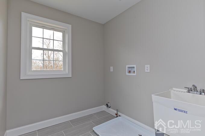 1214 Brookside Road Piscataway, NJ 08854 - Photo 21 of 26 a bathroom with a sink and a window