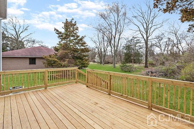 1214 Brookside Road Piscataway, NJ 08854 - Photo 25 of 26 a view of deck with furniture and trees around