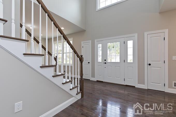 1214 Brookside Road Piscataway, NJ 08854 - Photo 6 of 26 a view of entryway with stairs and wooden floor