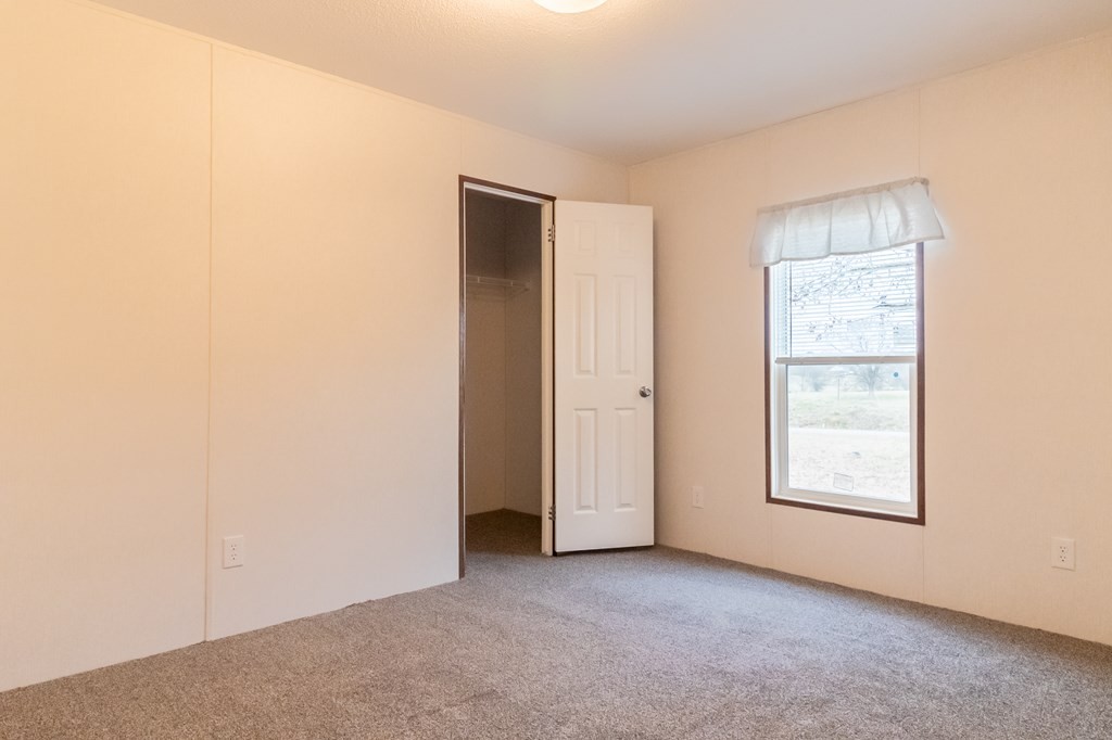 1944 Red Cut Road Chatsworth, GA 30705 - Photo 15 of 17 an empty room with windows and closet