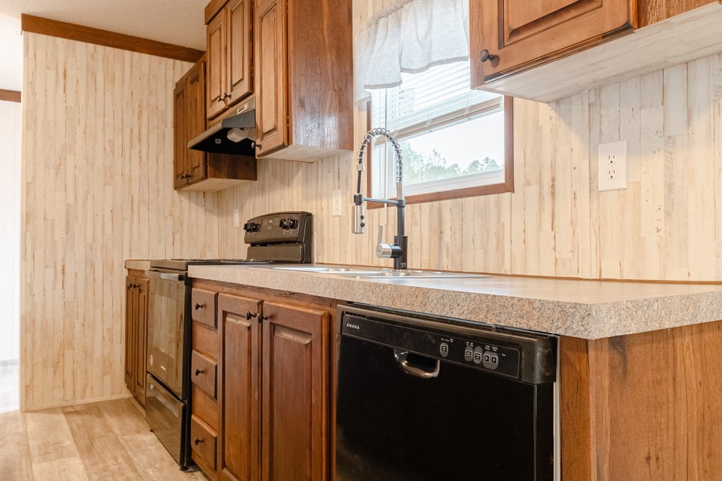 1944 Red Cut Road Chatsworth, GA 30705 - Photo 9 of 17 a kitchen with stainless steel appliances a sink and a window