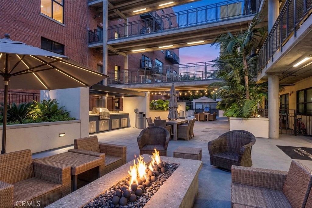 835 Locust Avenue, Unit 419 Long Beach, CA 90813 - Photo 44 of 51 A little twilight time in the community area