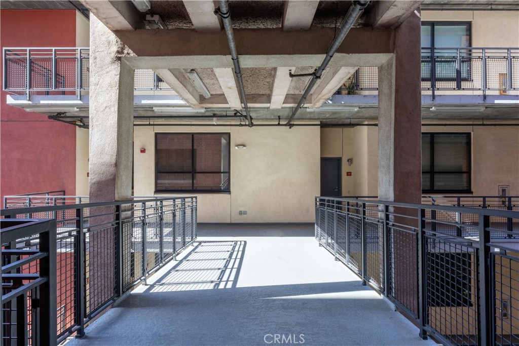 835 Locust Avenue, Unit 419 Long Beach, CA 90813 - Photo 8 of 51 Walkway from original building to north tower