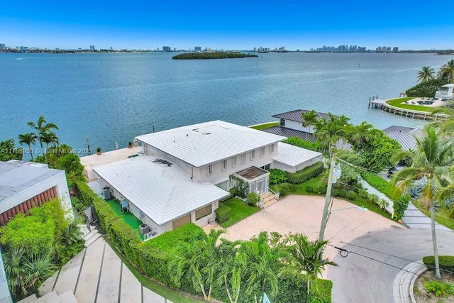 an aerial view of a house with a lake view