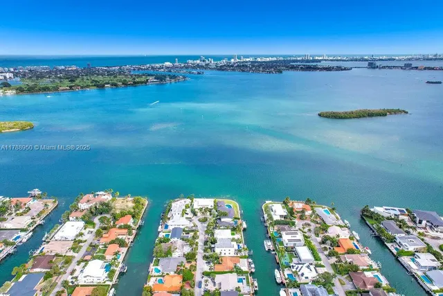 a view of a lake with a table and chairs
