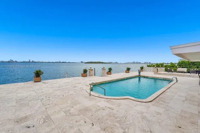 a view of a swimming pool and an ocean