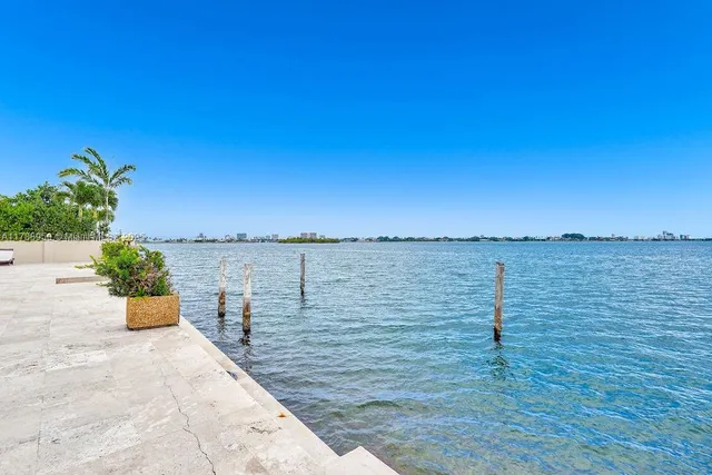 an aerial view of residential house with an outdoor space and seating