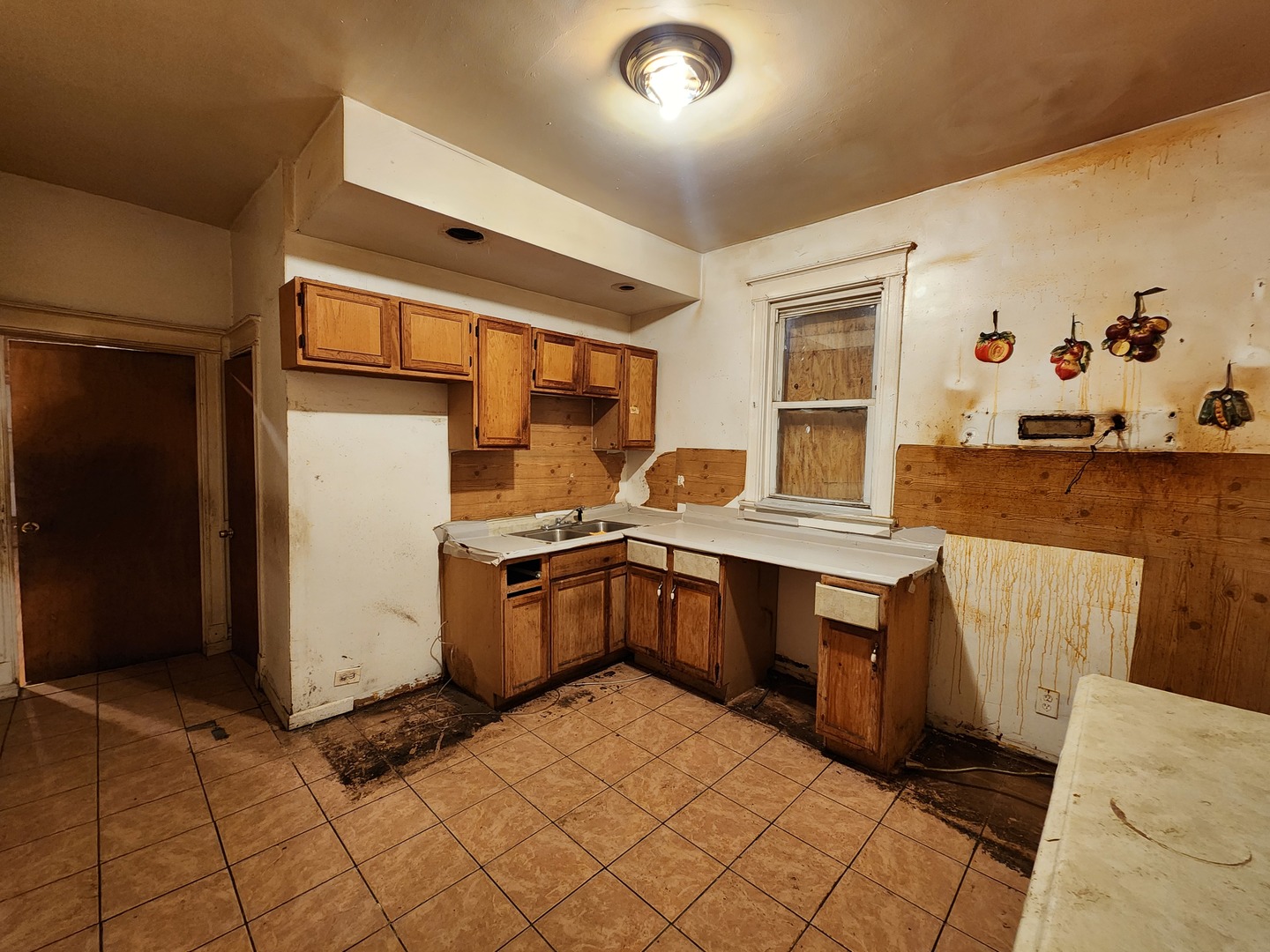 5242 South Sangamon Street Chicago, IL 60609 - Photo 6 of 14 a kitchen with stainless steel appliances a stove a sink and a refrigerator