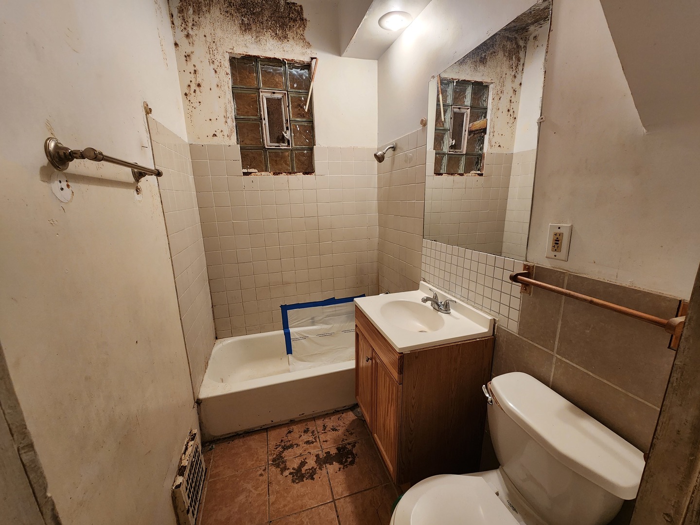 5242 South Sangamon Street Chicago, IL 60609 - Photo 7 of 14 a bathroom with a toilet sink and mirror